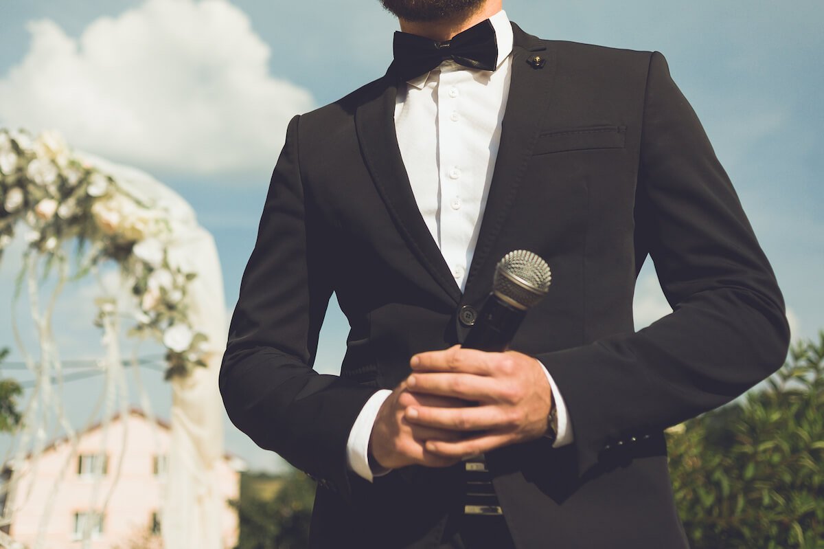 Winnie the Pooh extract for wedding readings | Image shows a groom holding a microphone.