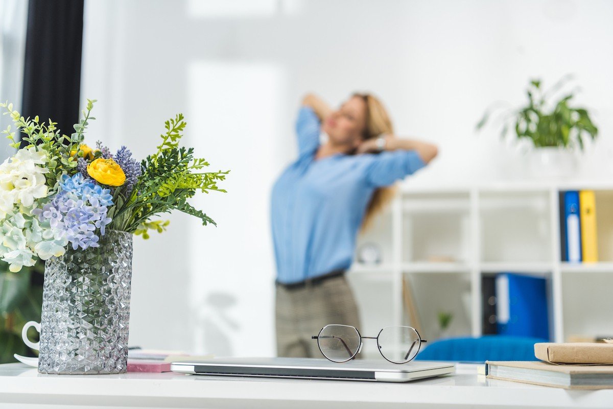 Woman Stretching in Office