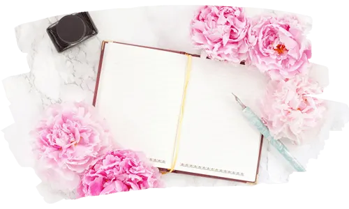 How to bullet journal | An open journal with a camera and pink peonies around it, on a a marble desktop.