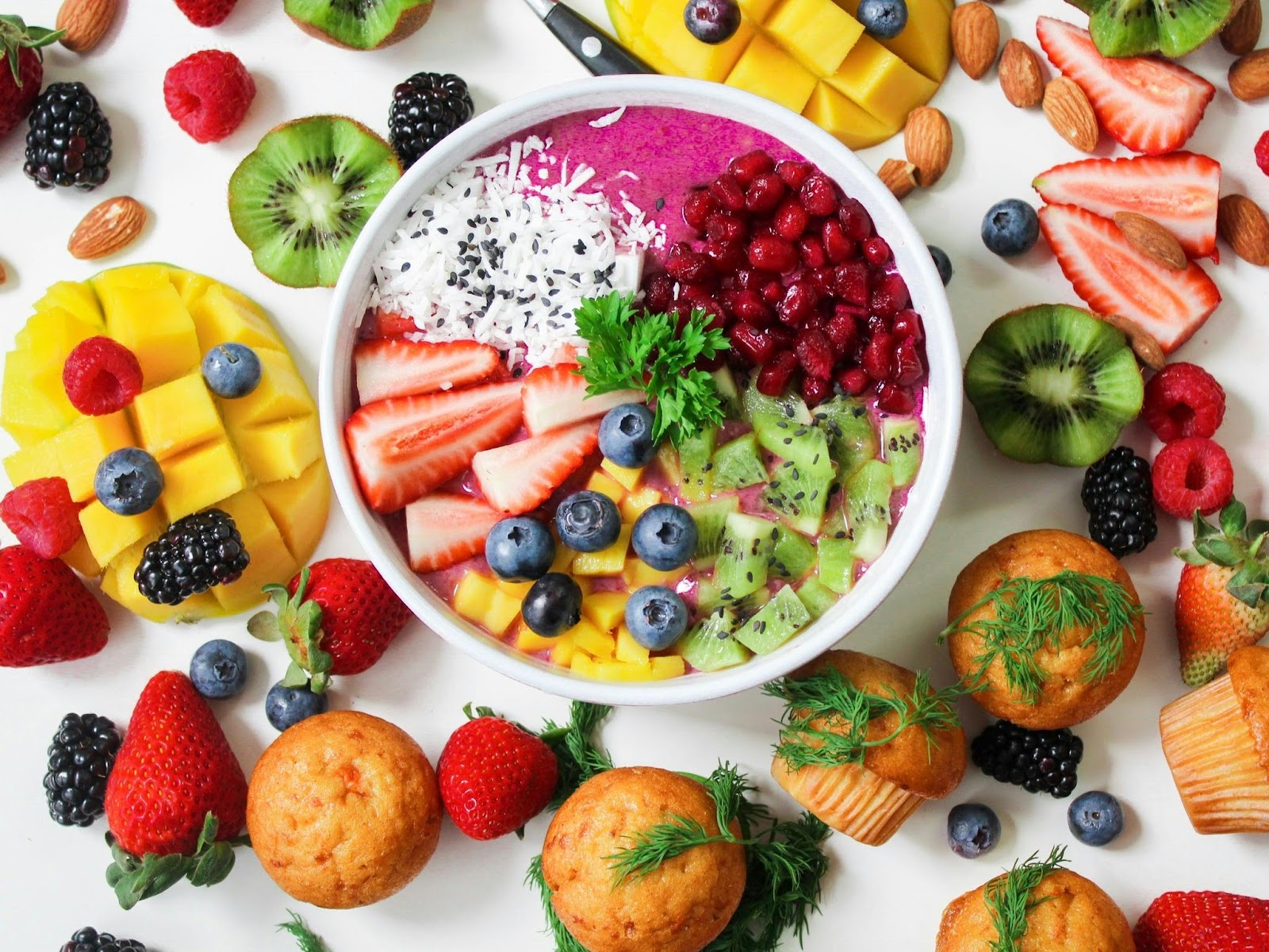 A flatlay showing brightly coloured spread of assorted fruit.